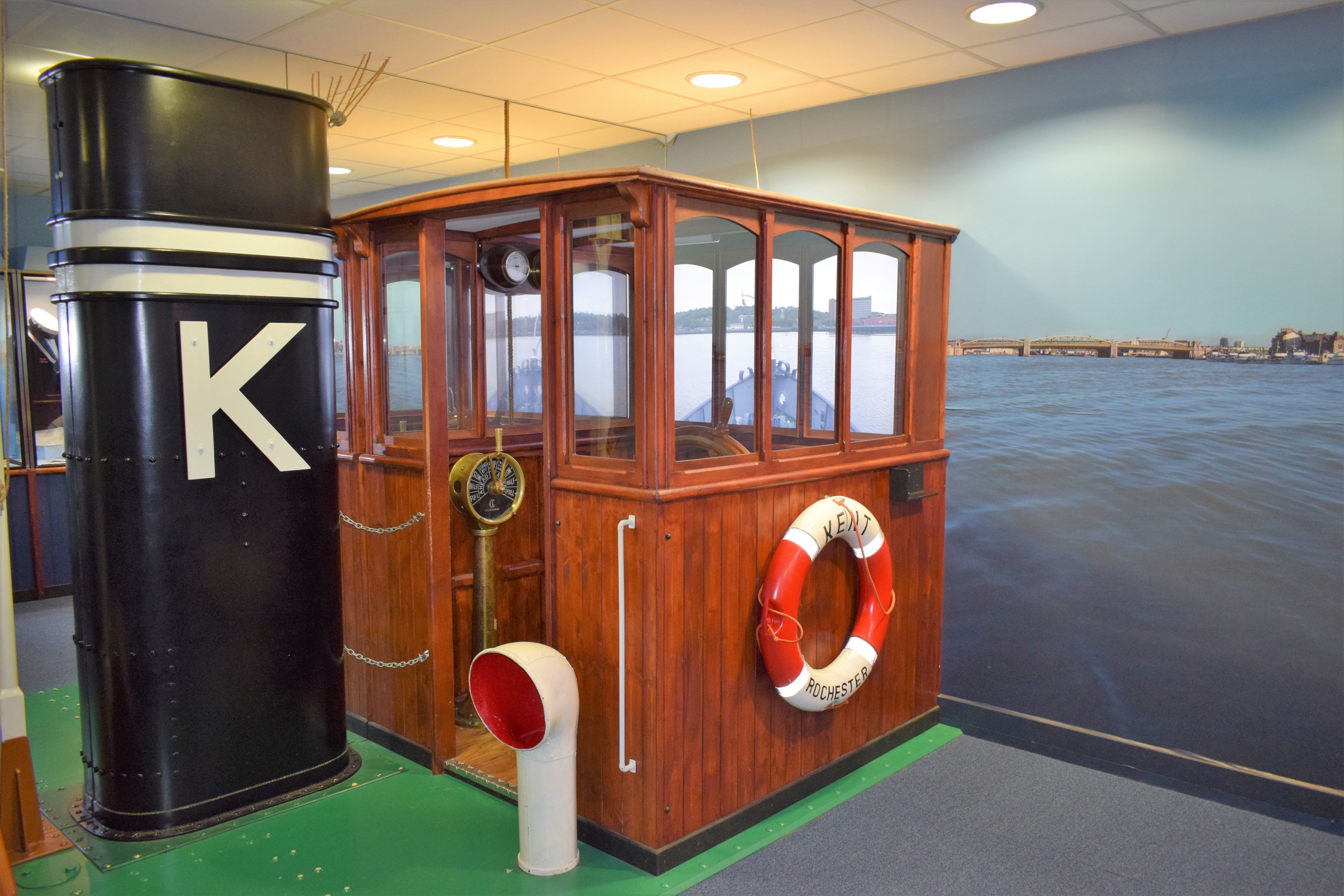 a reconstruction of a small ships wheelhouse that children can use to pretend to drive the boat