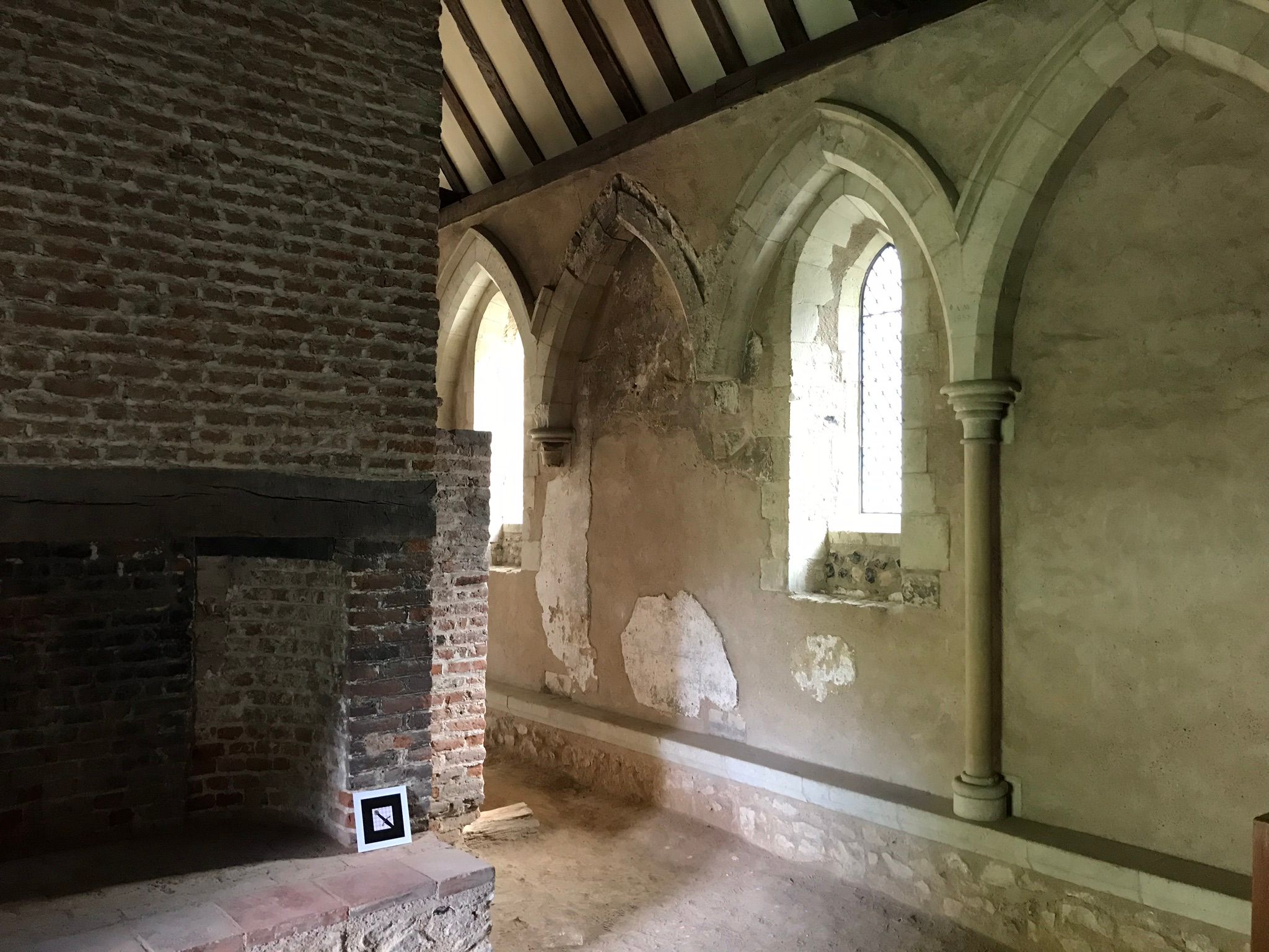 Inside the 13th Century hall of Temple Manor, where you can see the carved window arches and old fire place