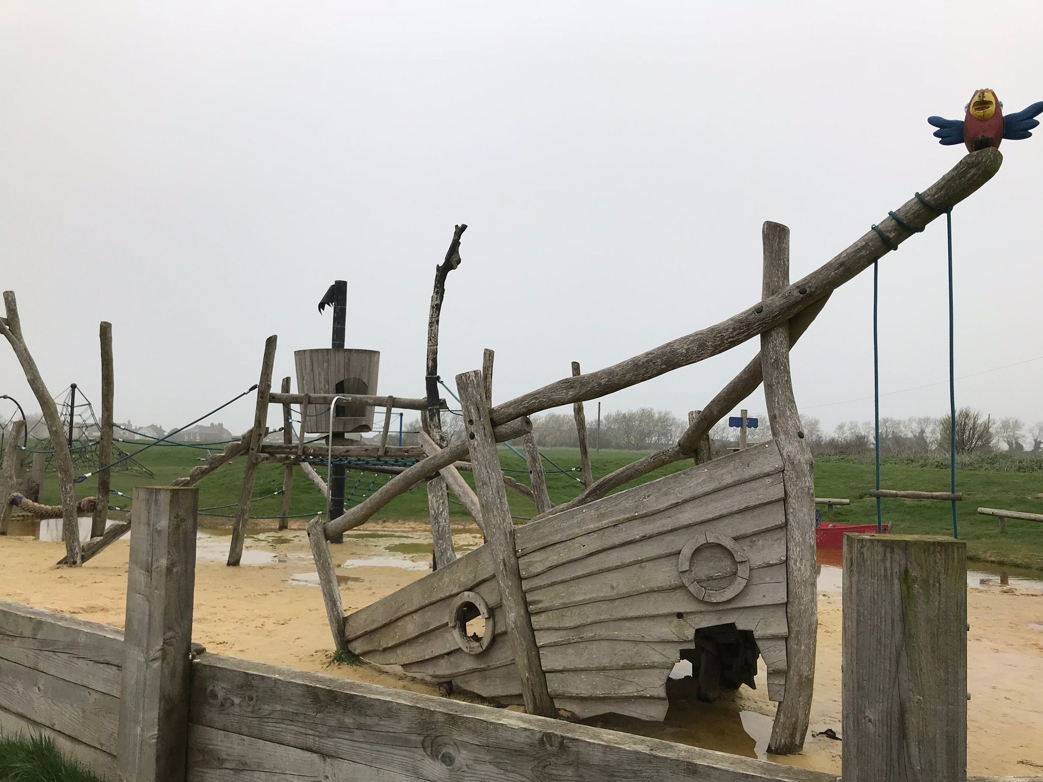 Pirate themed wooden play equipment in the sand pit