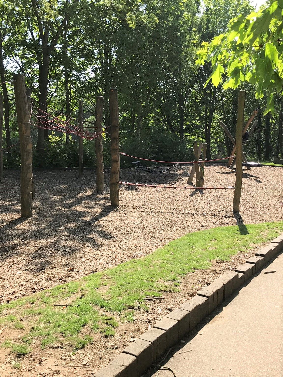 Children's play park in the wooded area.