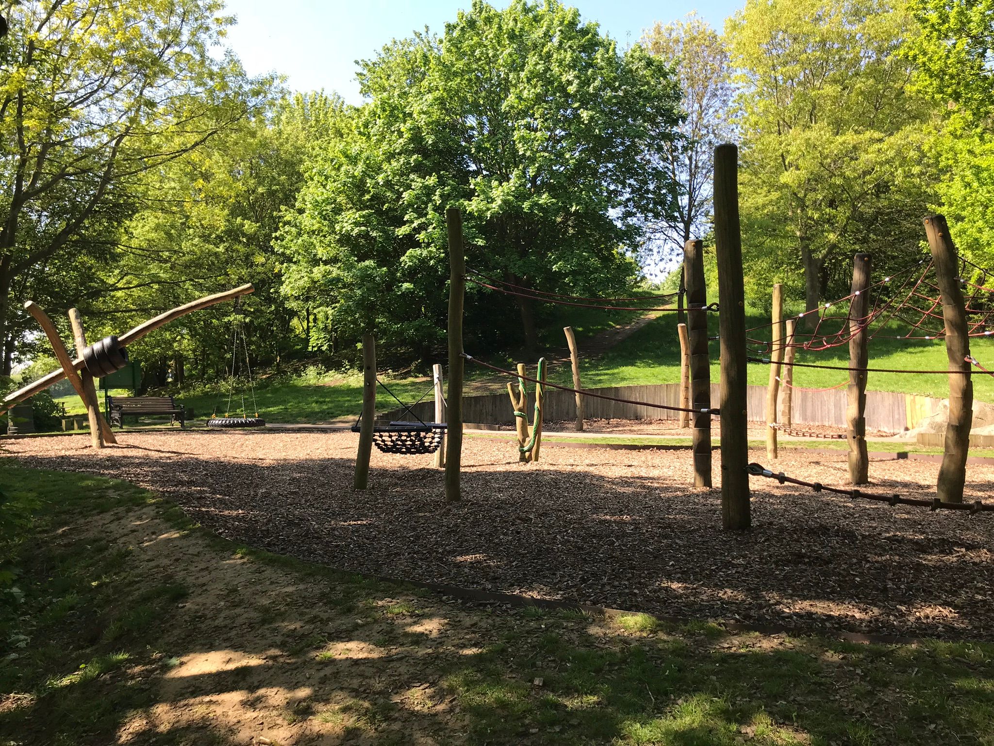 Chilrdren's play park in the wooded area.