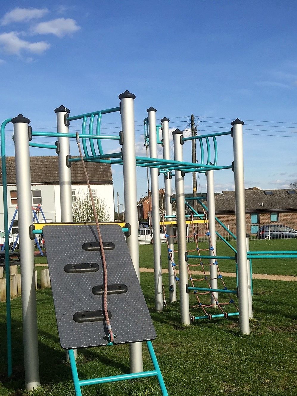 Older children's climbing frame with high monkey bars and bar slide