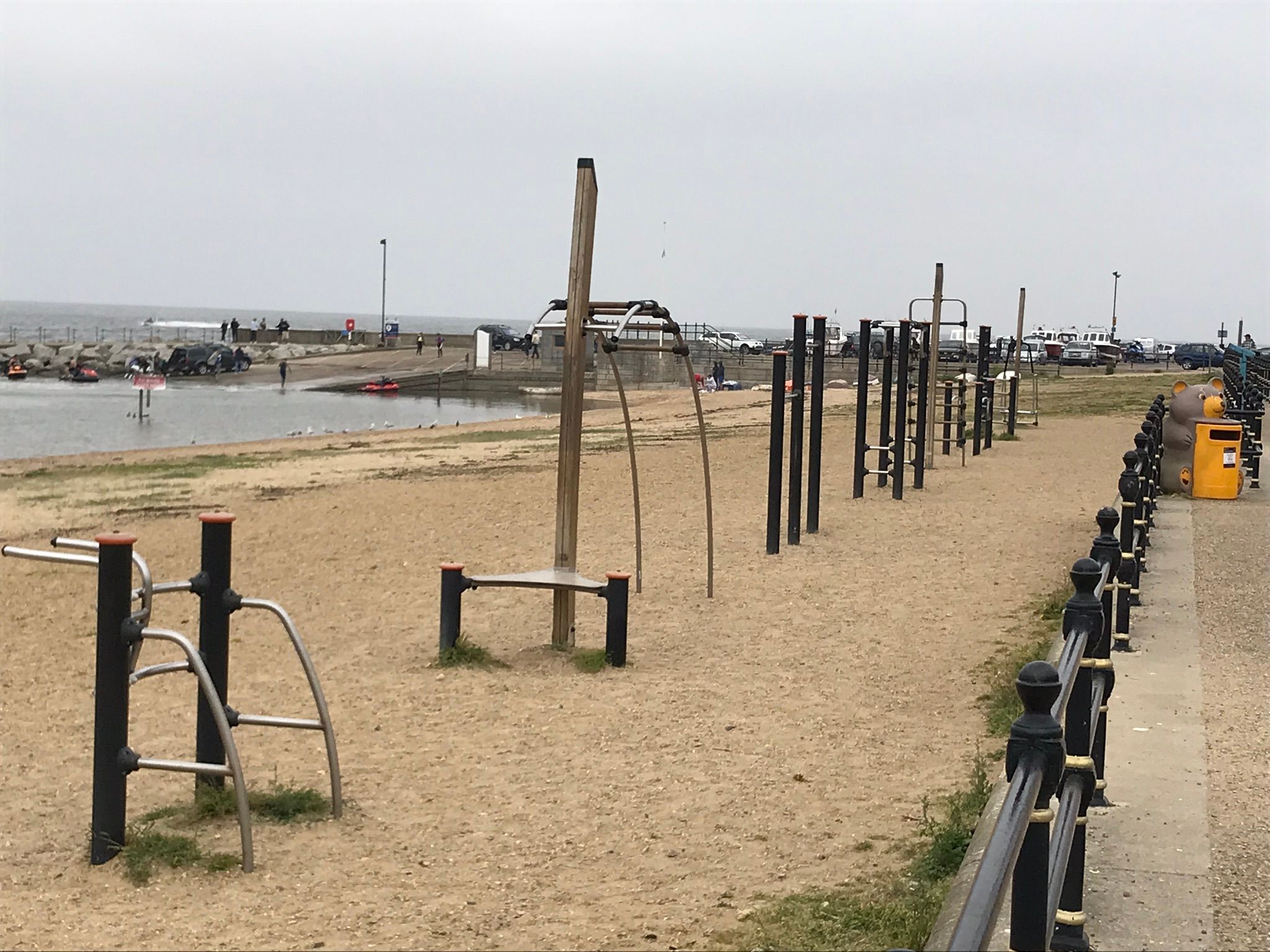 Gym and assault course style equipment on the beach.
