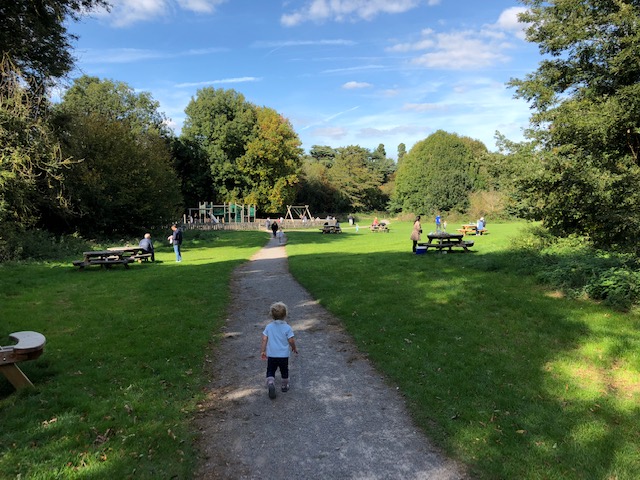 Picnic tables and open space for play at Manor Park Country Park