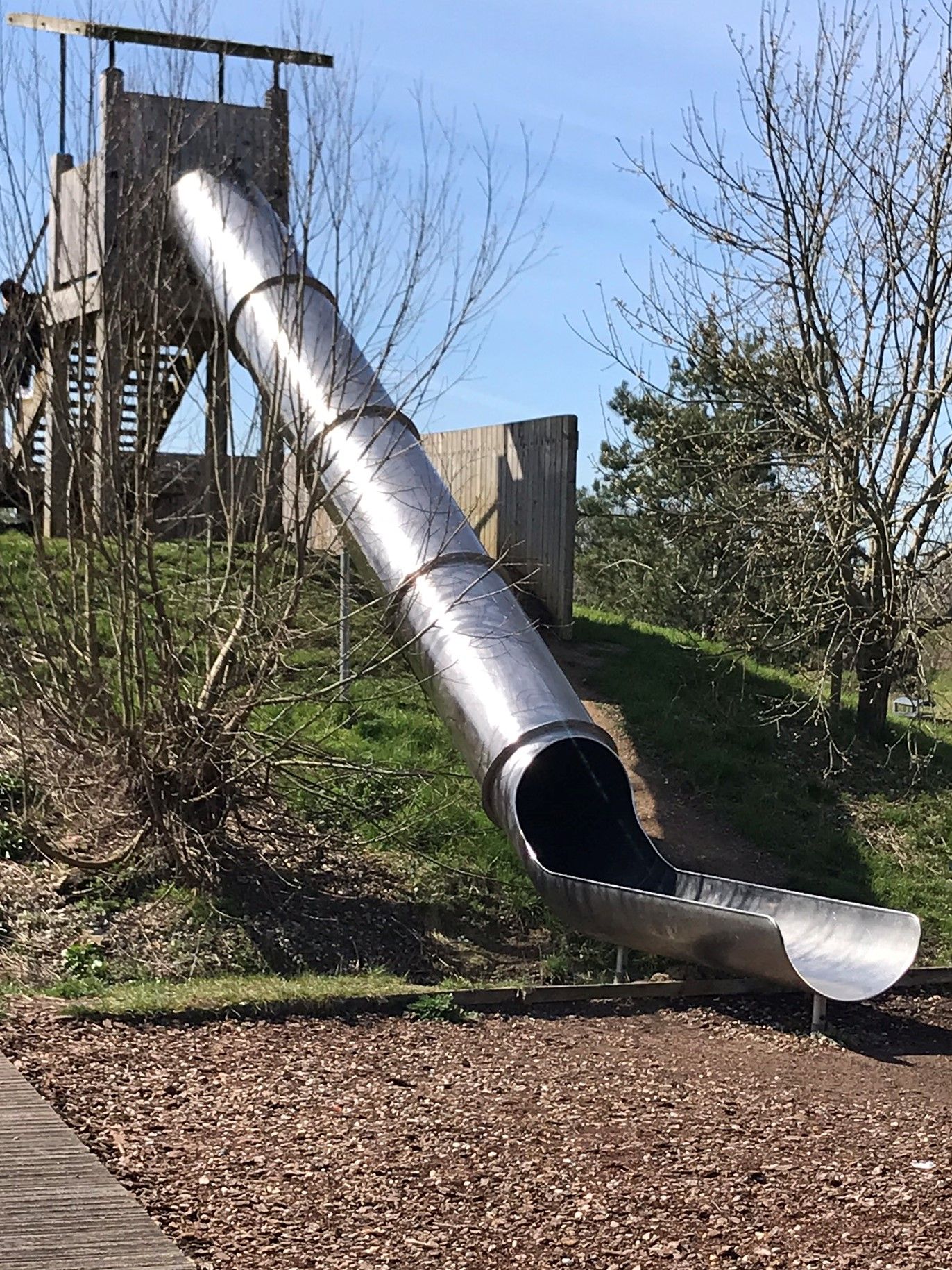 A long metal tunnel slide.