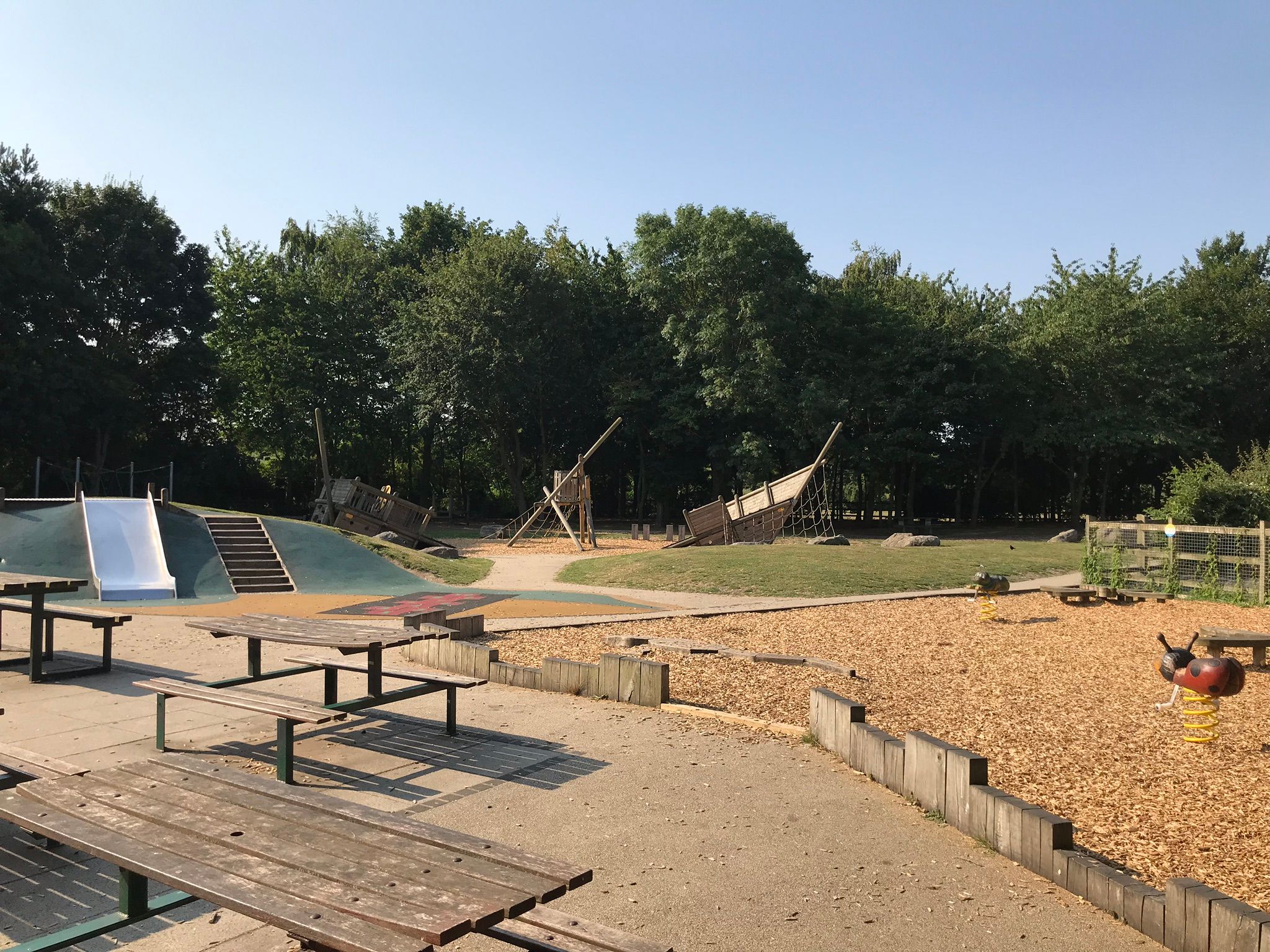 The children's play area at Riverside Country Park, slide and sunken pirate ship play equipment