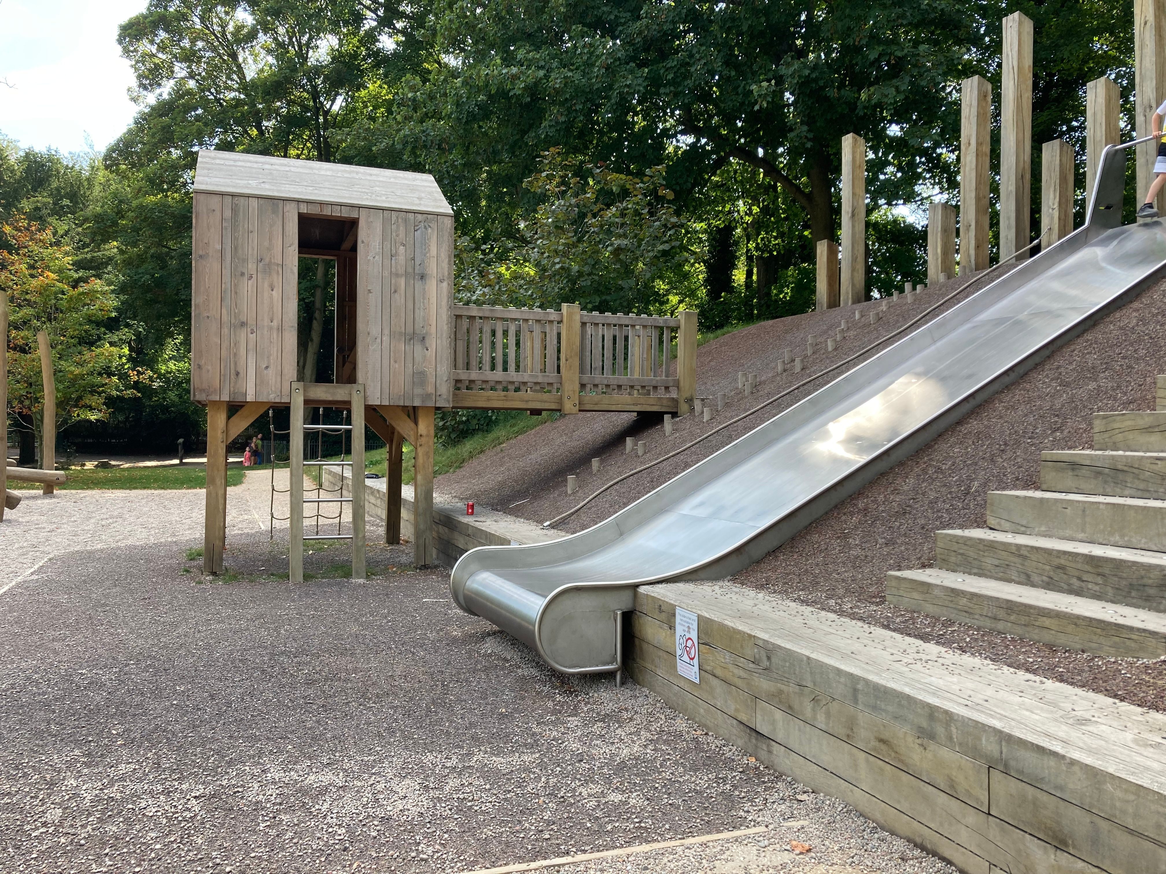 The play area at Russell gardens, the long fast slide and little house