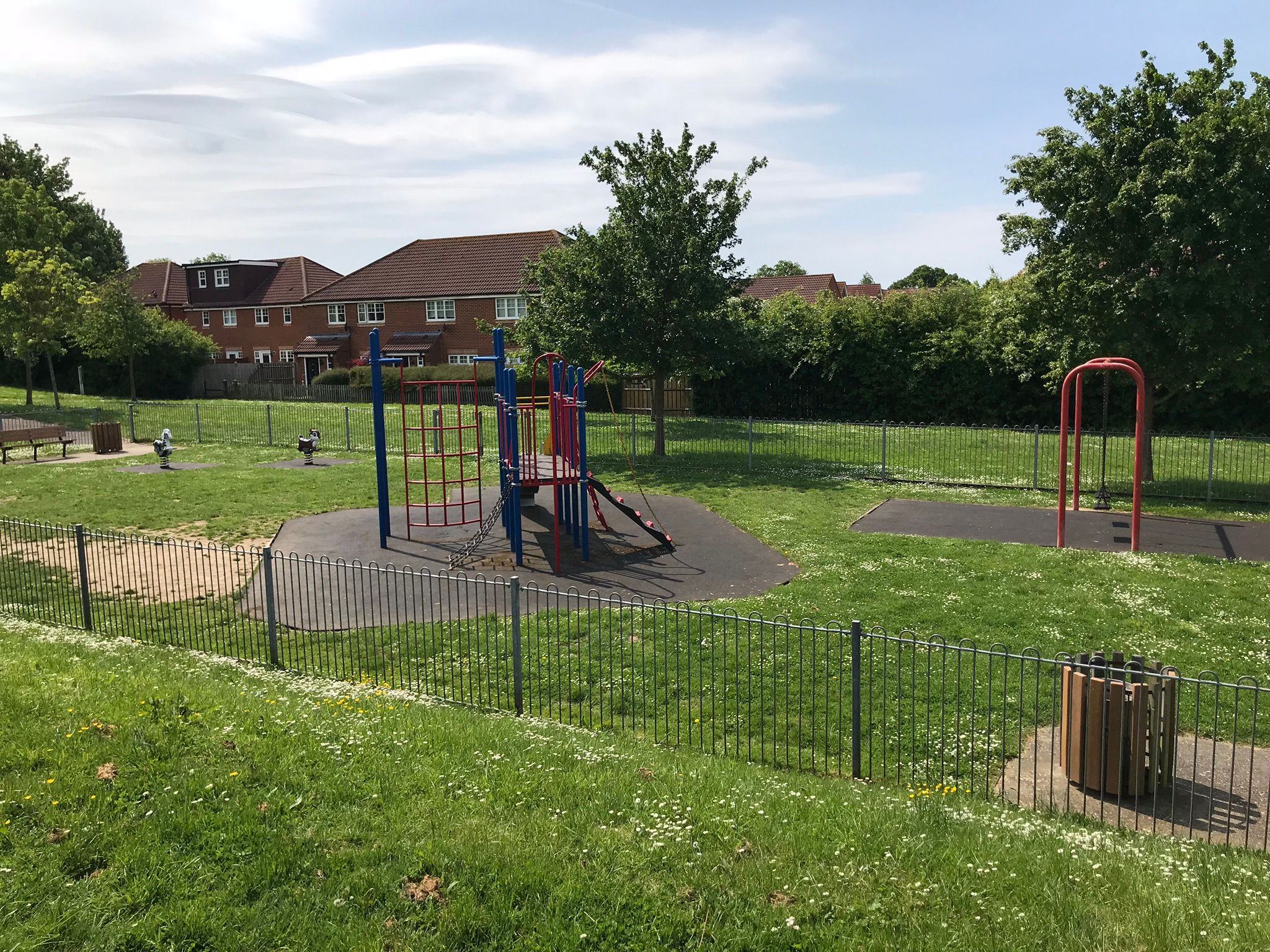 second play area with climbing frame and swings.