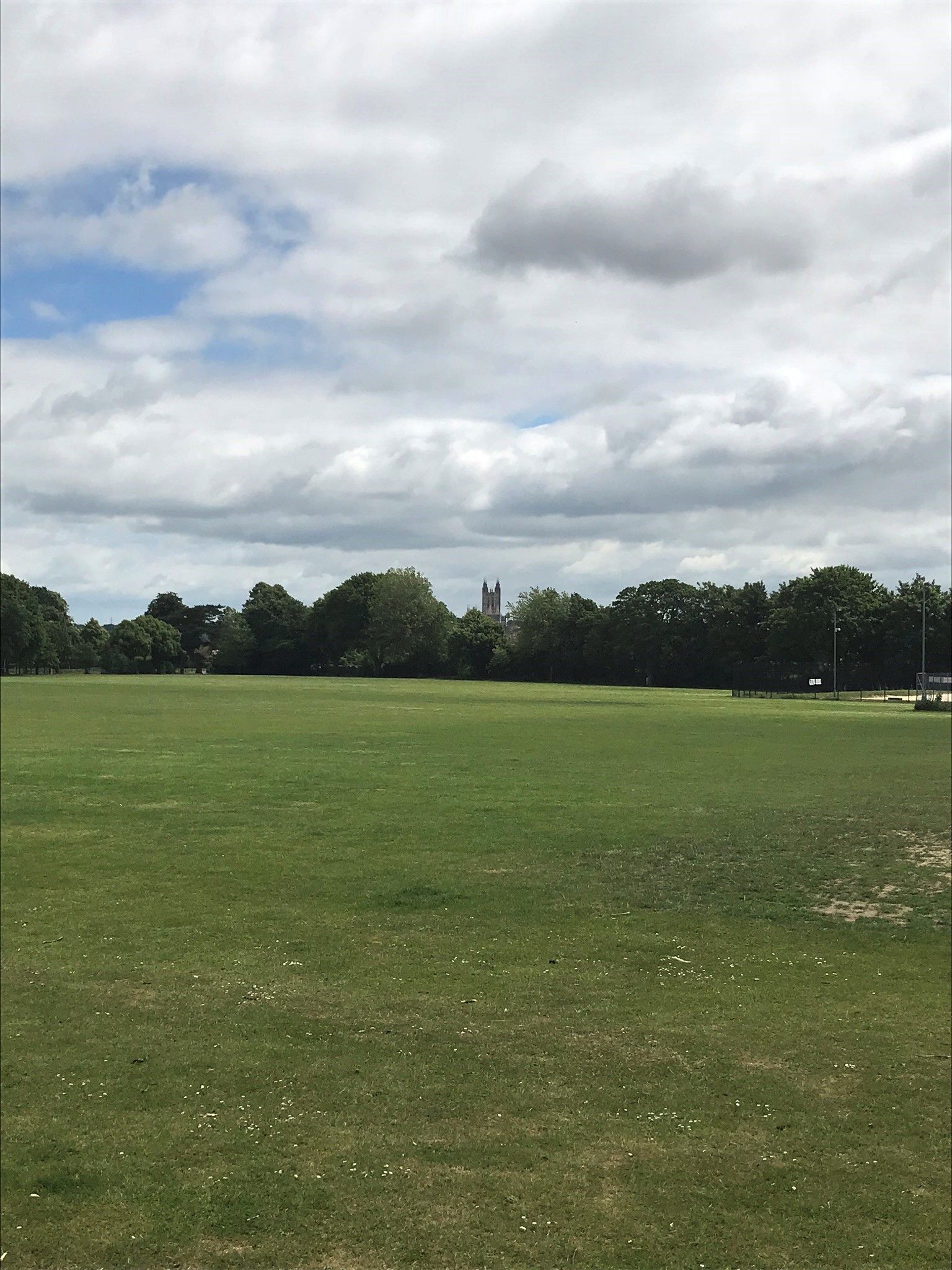 View across the large playing fields towards Canterbury Cathedral