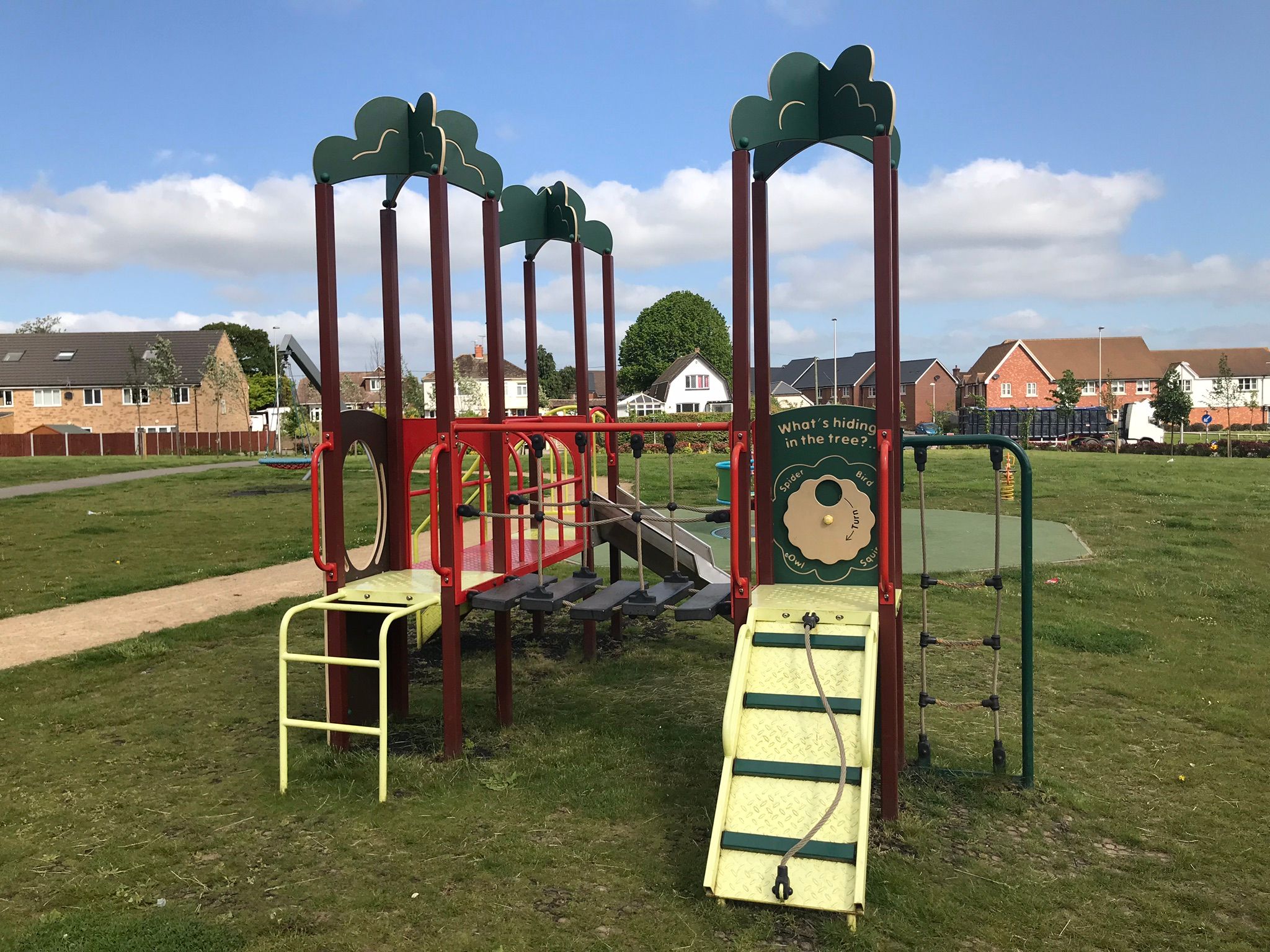 Younger children's climbing frame with slide