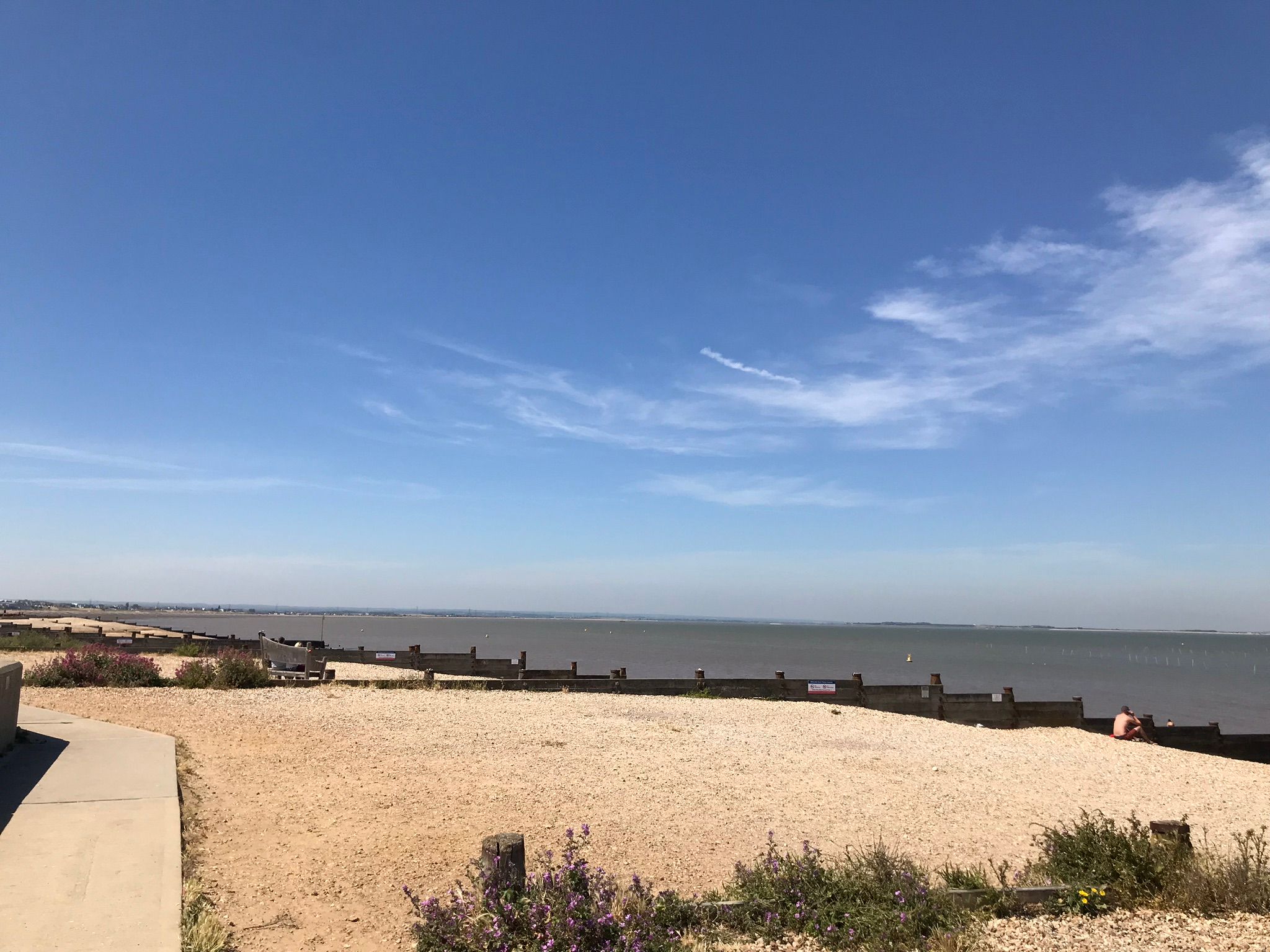 The beautiful shingle beach at whitstable and oyster beds in the distance